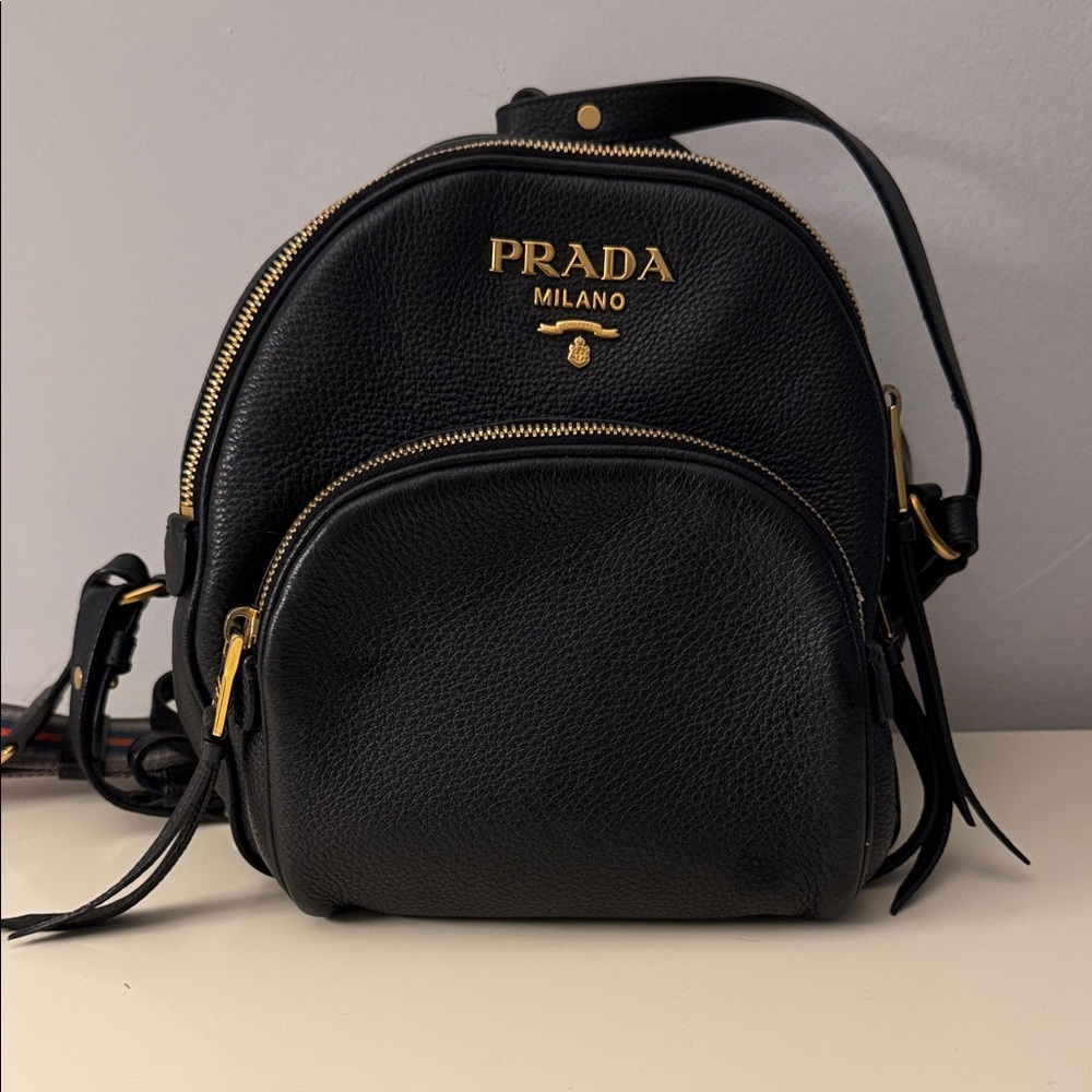 Prada Black Leather Backpack with Gold Accents